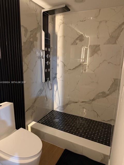 13003 Southwest 195th Street, Unit 2 Miami, FL 33177 - Photo 5 of 7 a bathroom with a toilet and a shower