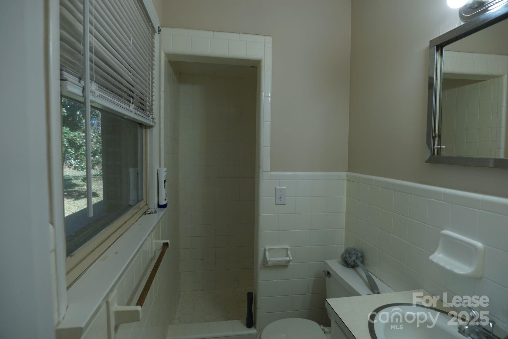 4705 Grace Chapel Road Granite Falls, NC 28630 - Photo 11 of 14 a bathroom with a toilet and a shower