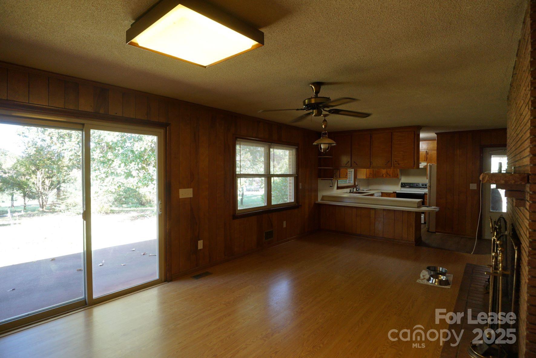 4705 Grace Chapel Road Granite Falls, NC 28630 - Photo 6 of 14 a open kitchen with stainless steel appliances granite countertop a stove and a refrigerator