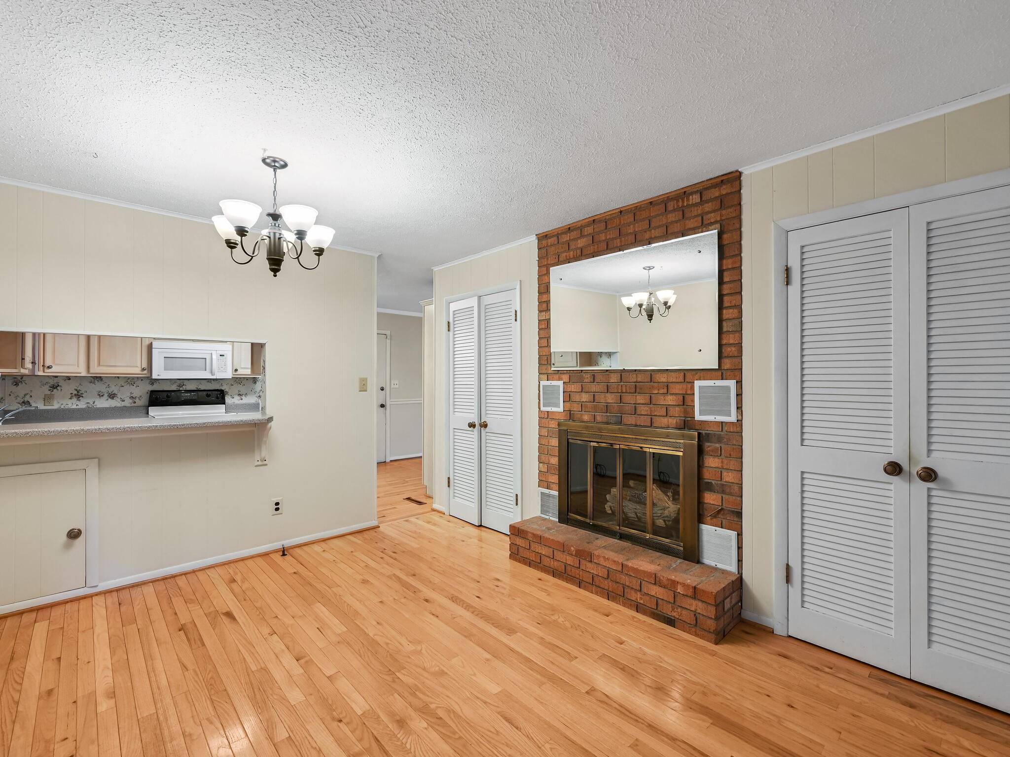 126 Apache Drive Hendersonville, NC 28739 - Photo 11 of 30 a view of a livingroom with an empty space and a fireplace
