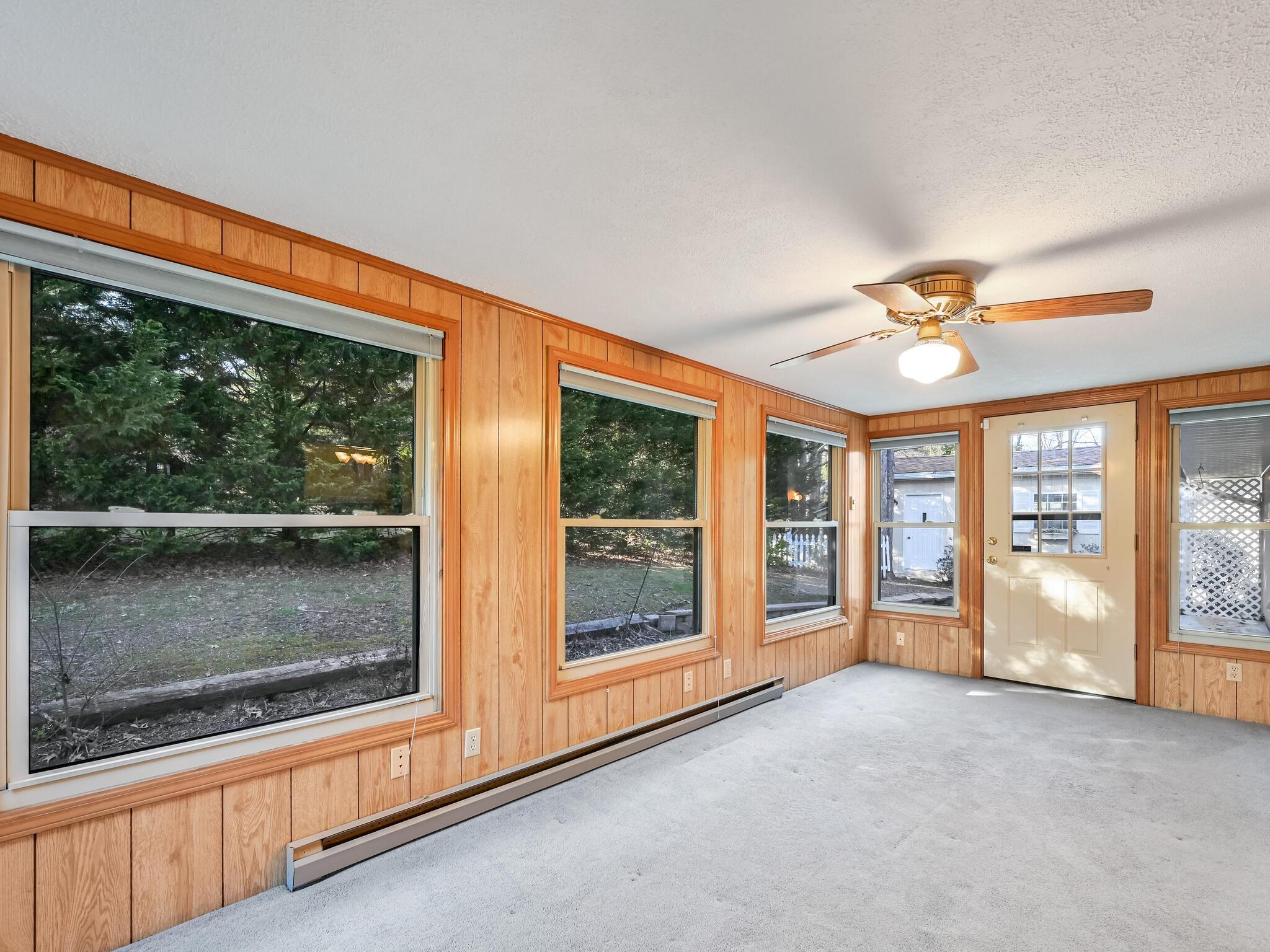 126 Apache Drive Hendersonville, NC 28739 - Photo 12 of 30 a view of an empty room with a window and a fireplace