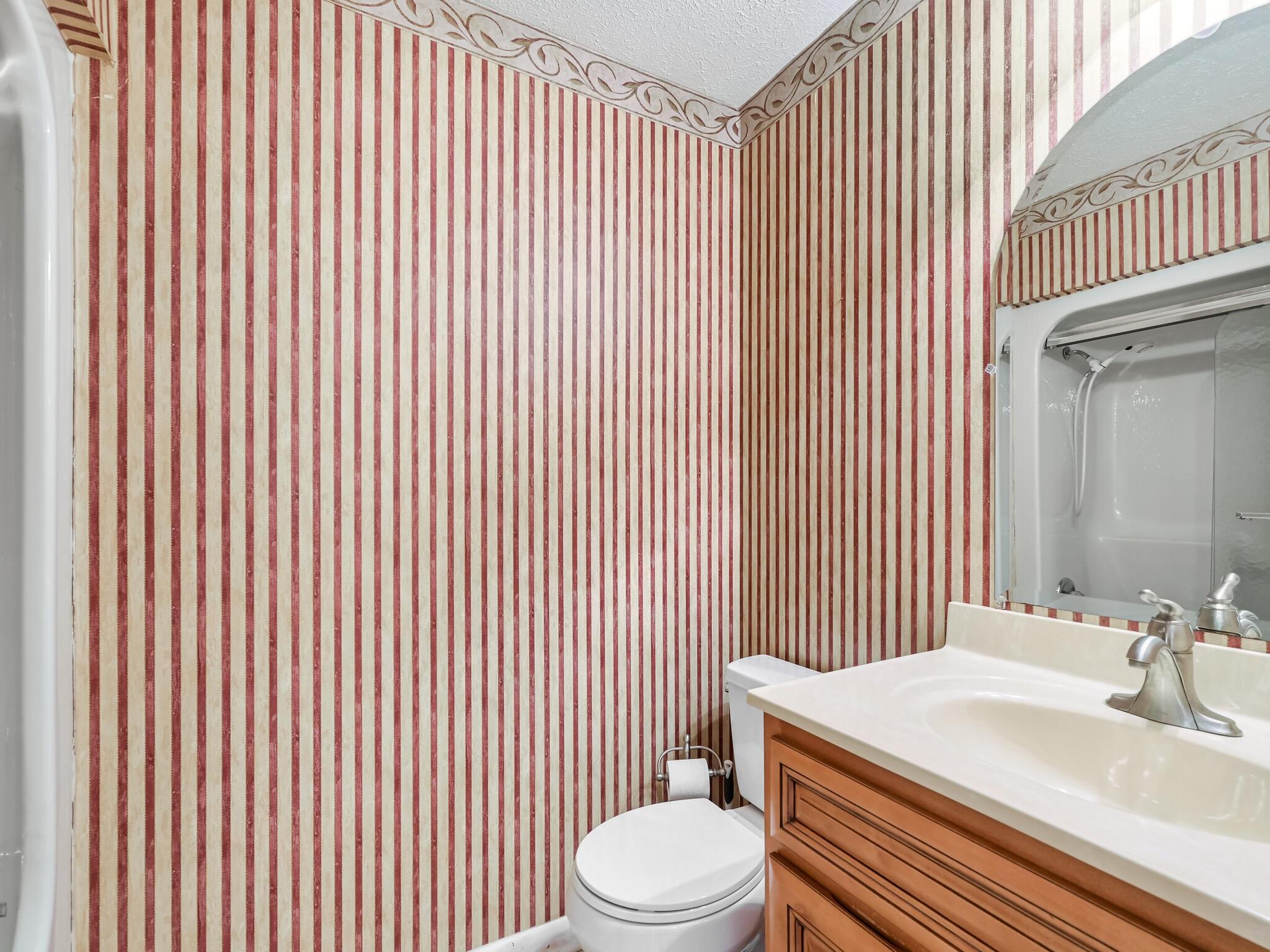 126 Apache Drive Hendersonville, NC 28739 - Photo 14 of 30 a bathroom with a sink a toilet and mirror