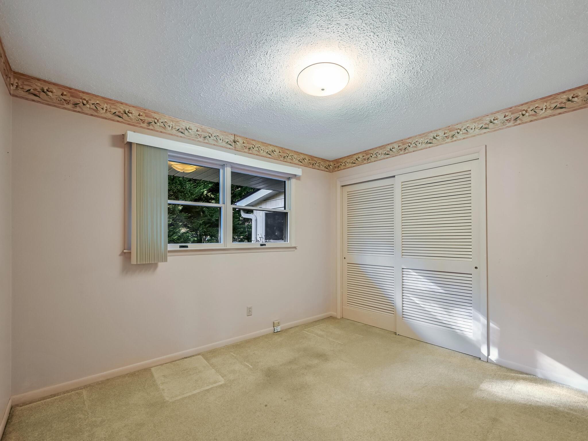 126 Apache Drive Hendersonville, NC 28739 - Photo 15 of 30 a view of an empty room with a window