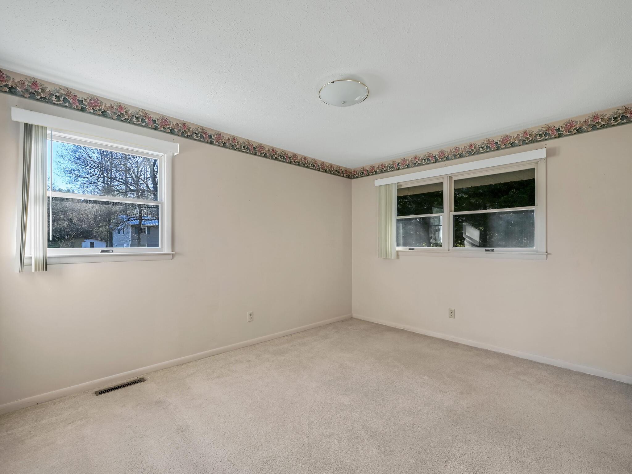 126 Apache Drive Hendersonville, NC 28739 - Photo 16 of 30 a view of empty room with windows