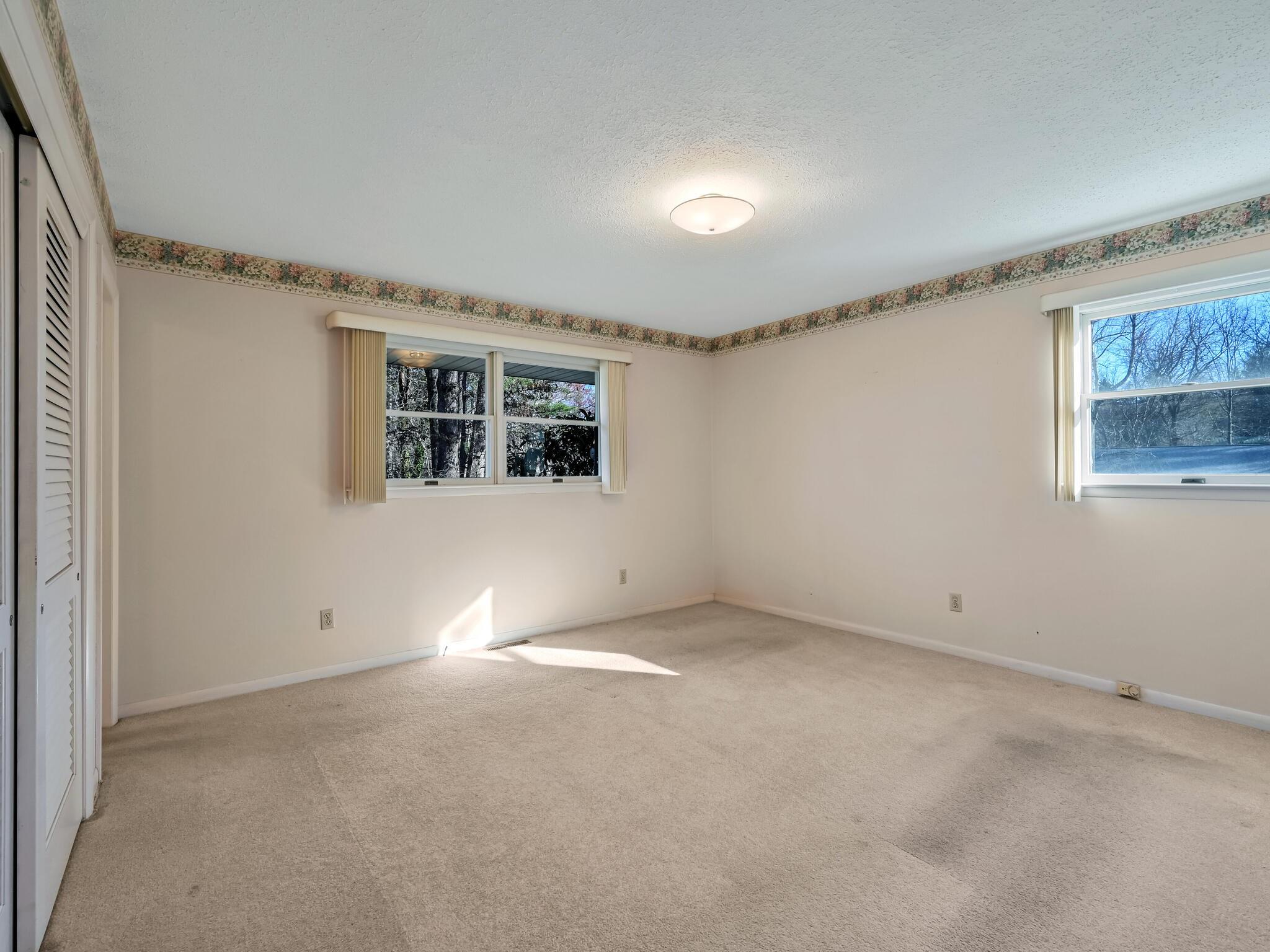126 Apache Drive Hendersonville, NC 28739 - Photo 18 of 30 an empty room with windows
