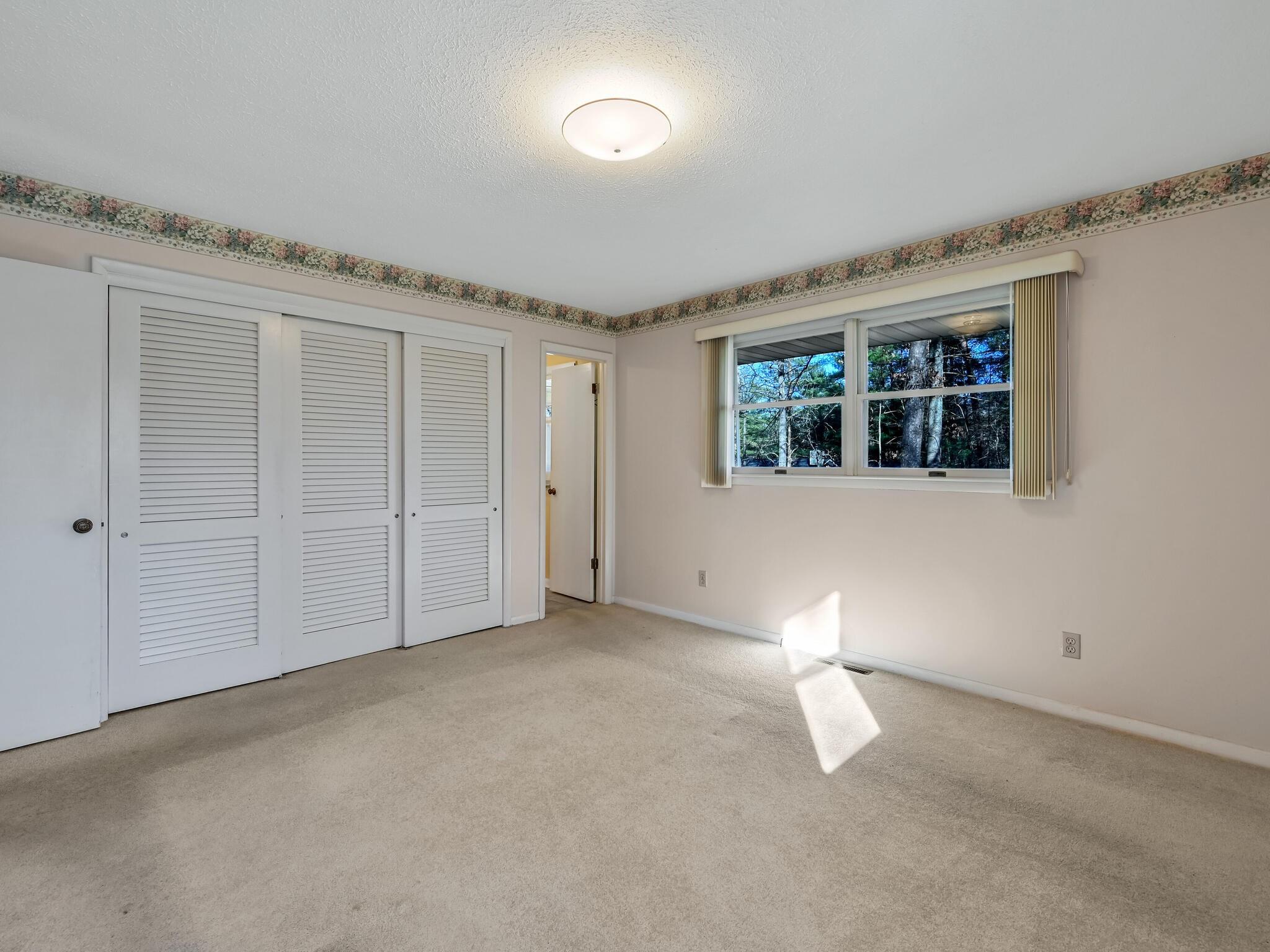 126 Apache Drive Hendersonville, NC 28739 - Photo 19 of 30 an empty room with windows