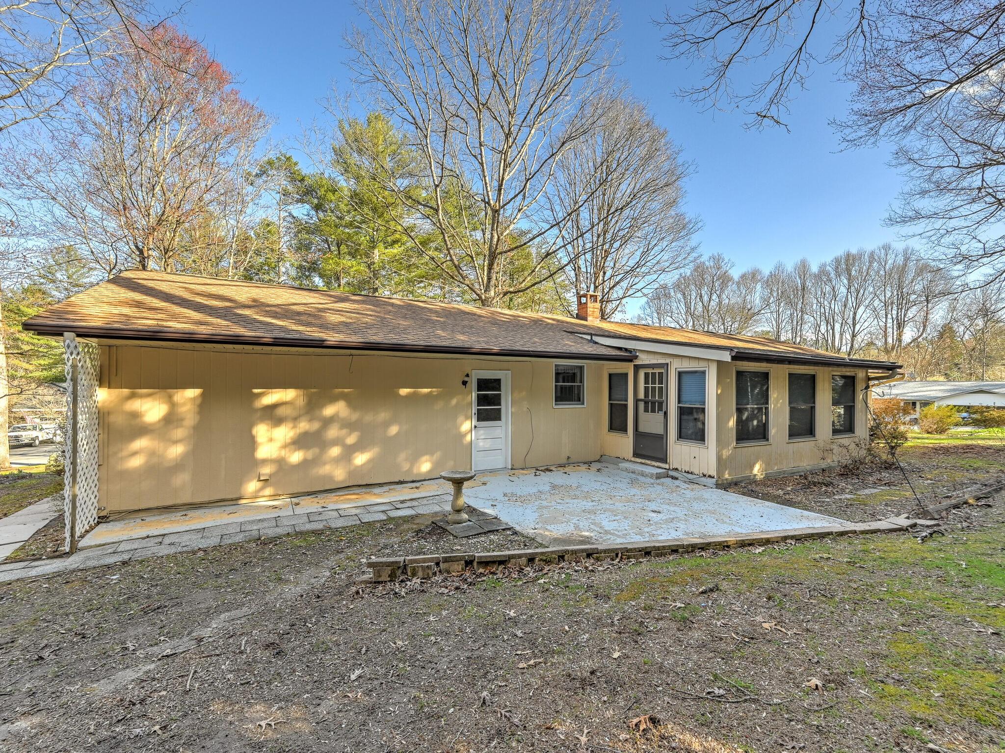 126 Apache Drive Hendersonville, NC 28739 - Photo 23 of 30 a front view of a house with a yard and garage