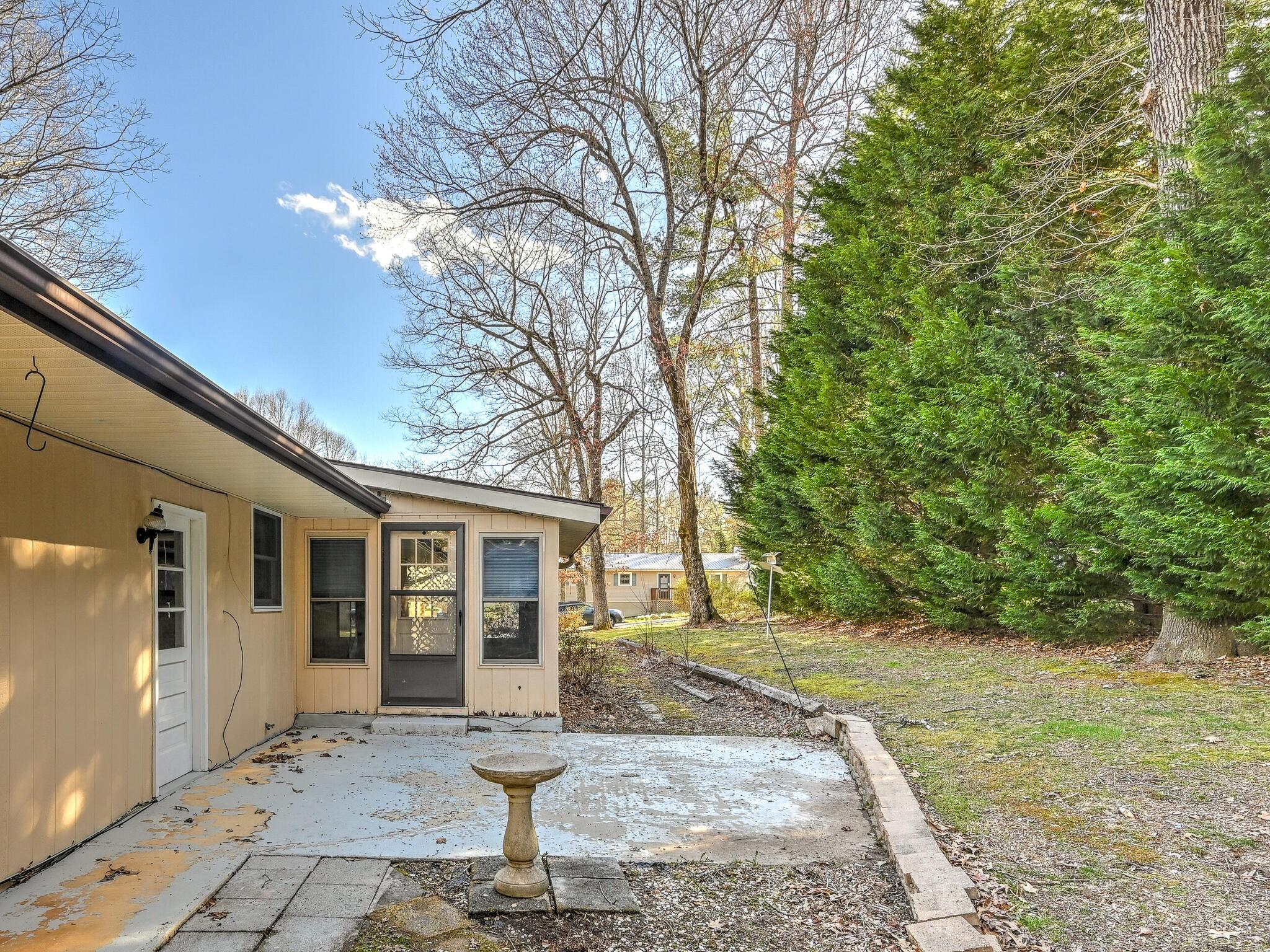 126 Apache Drive Hendersonville, NC 28739 - Photo 24 of 30 a front view of a house with garden