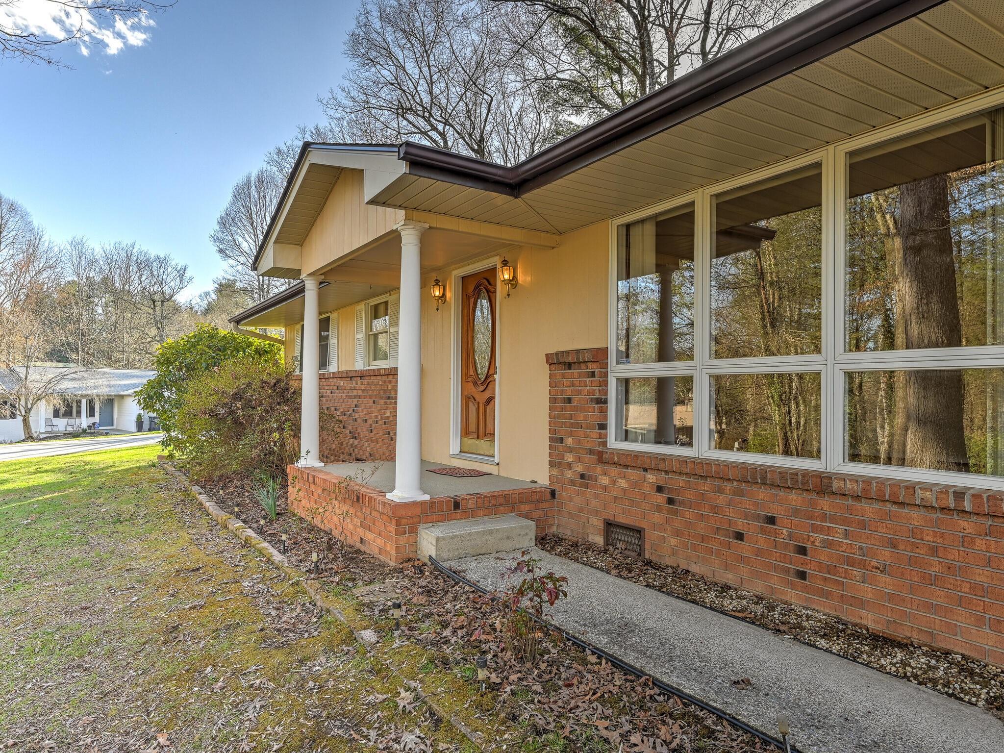 126 Apache Drive Hendersonville, NC 28739 - Photo 3 of 30 a front view of a house with a yard