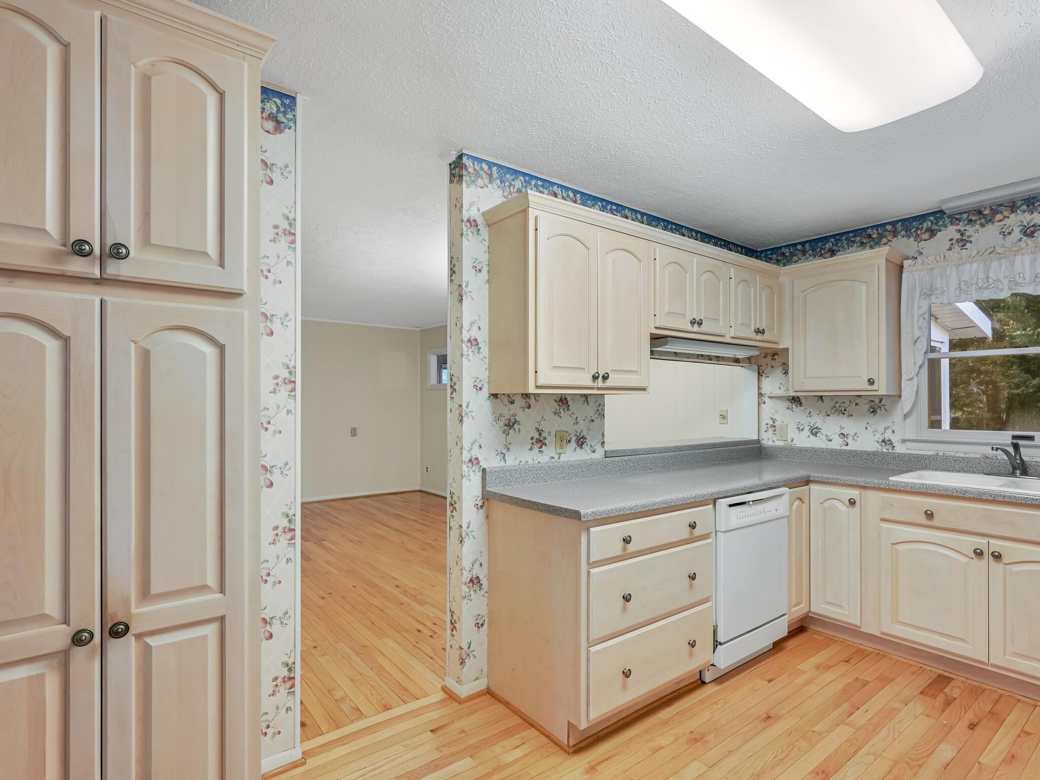 126 Apache Drive Hendersonville, NC 28739 - Photo 8 of 30 a kitchen with white cabinets and sink