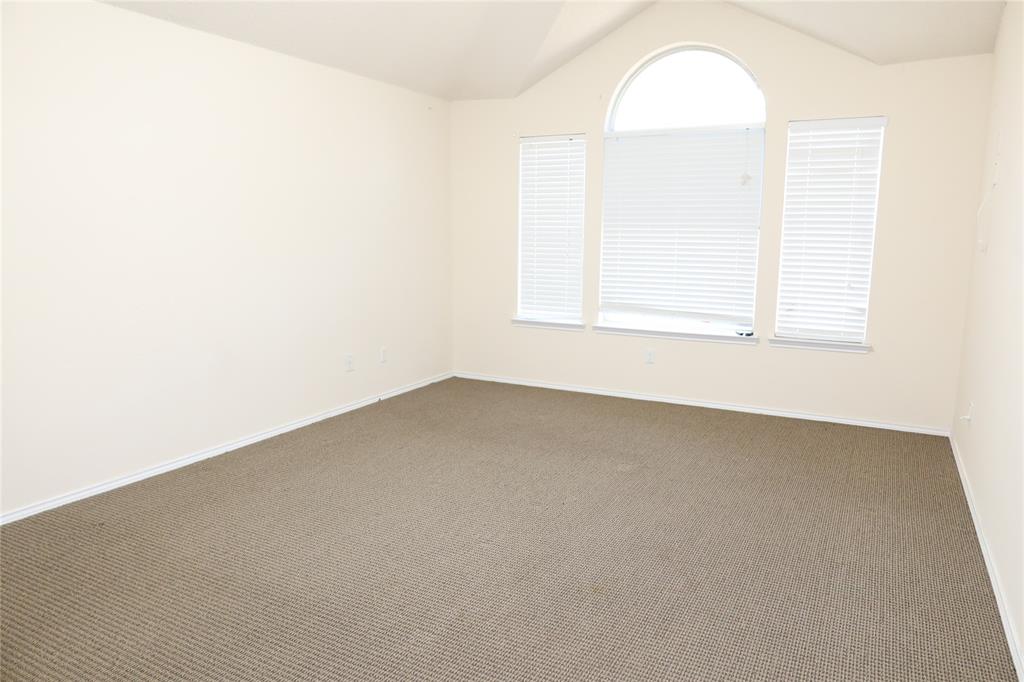 4419 Malvern Hill Road Grand Prairie, TX 75052 - Photo 16 of 24 an empty room with a window
