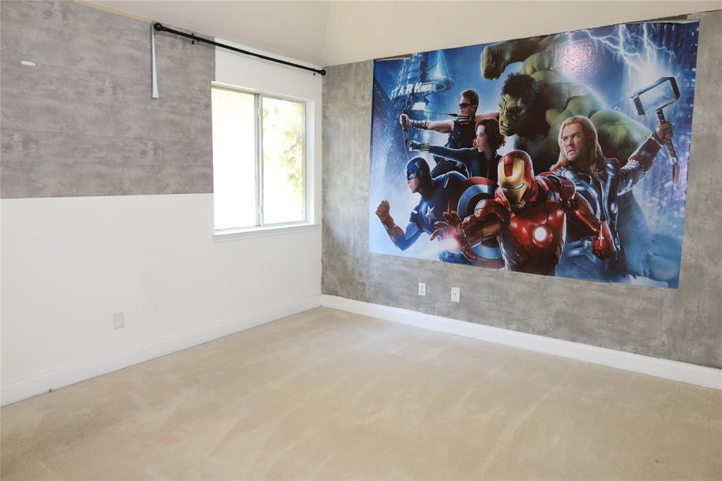 4419 Malvern Hill Road Grand Prairie, TX 75052 - Photo 19 of 24 a view of a living room with clothes and a window
