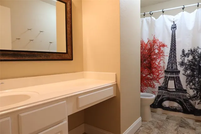 a bathroom with a bathtub and shower