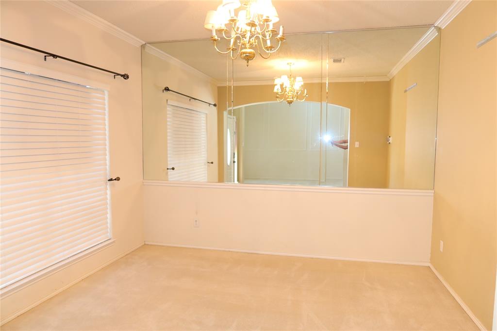 4419 Malvern Hill Road Grand Prairie, TX 75052 - Photo 3 of 24 a view of a bathroom with a shower and a chandelier