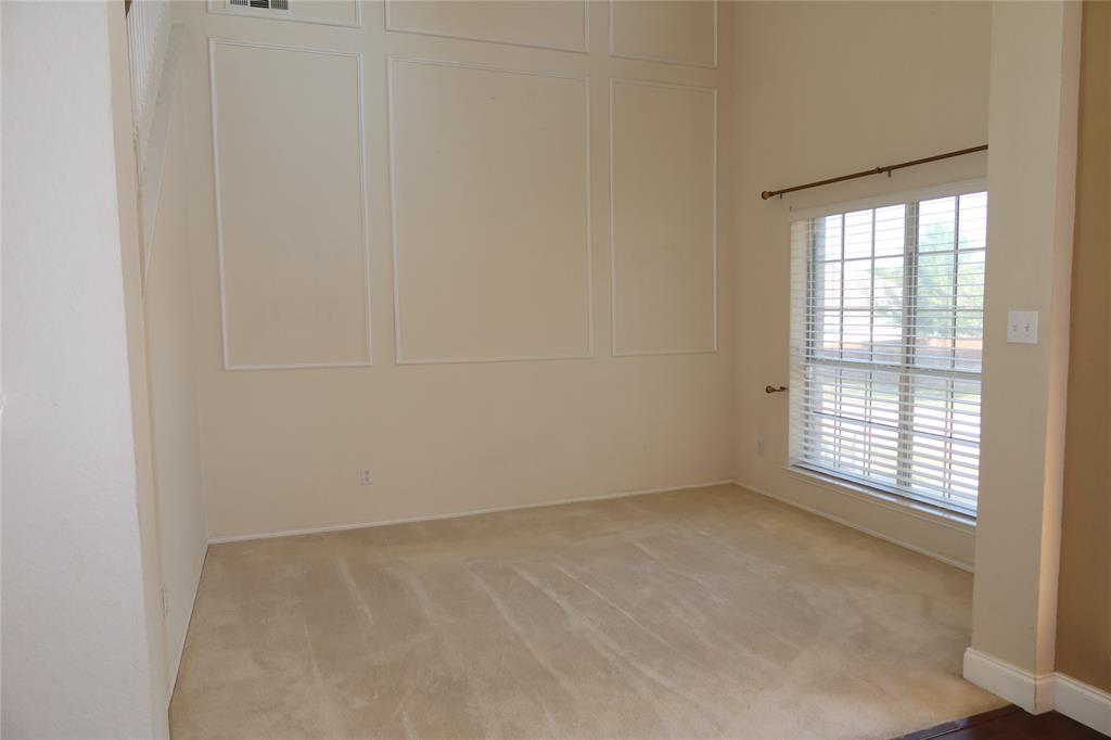 4419 Malvern Hill Road Grand Prairie, TX 75052 - Photo 4 of 24 an empty room with a window