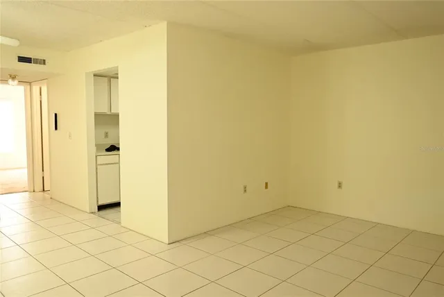a kitchen with a sink and refrigerator