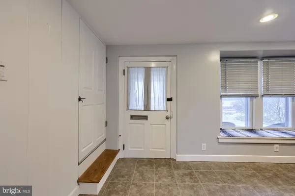 a spacious bedroom with a bed and window