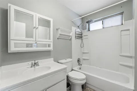 a bathroom with a sink a toilet and a bathtub