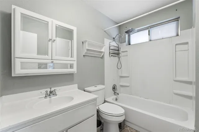 a bathroom with a sink a toilet and a bathtub