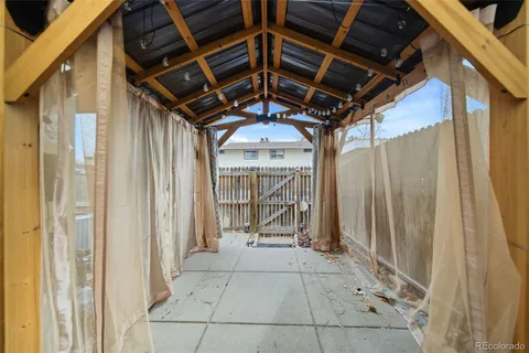 a aerial view of a brick house next to a yard