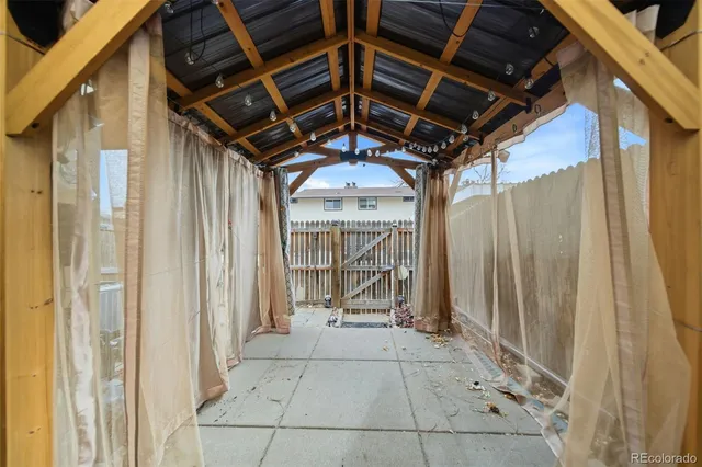a aerial view of a brick house next to a yard
