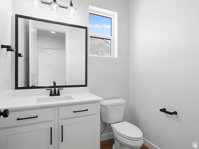 1711 West Canyon Rim Road North Lehi, UT 84048 - Photo 20 of 31 Bathroom featuring white cabinetry, a rectangular undermount sink, white countertop, and matte black fixtures