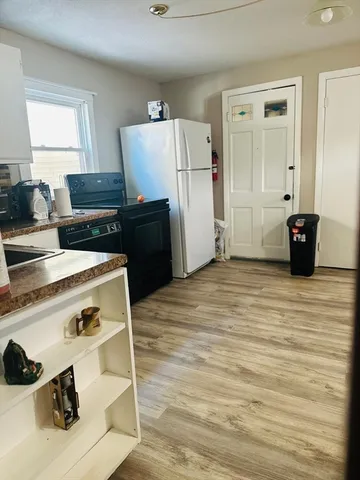 a bathroom with a sink and mirror with toilet