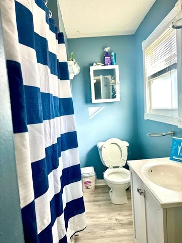 a bedroom with a bed and a chair