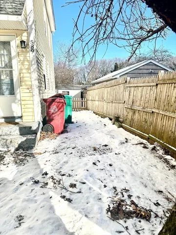 a view of a backyard of the house