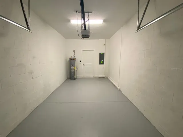 a view of empty room with chandelier