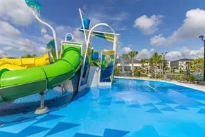 a view of a swimming pool with a yard