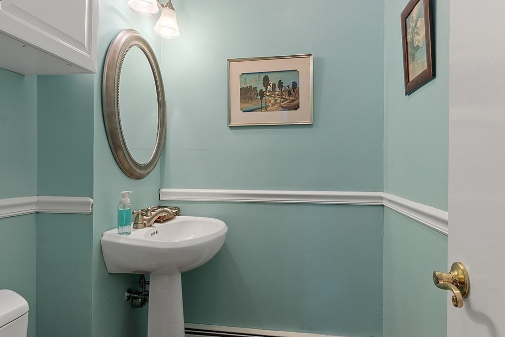 14 Scenna Road Beverly, MA 01915 - Photo 19 of 42 a bathroom with a sink and mirror