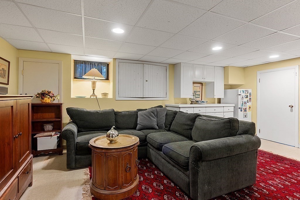 14 Scenna Road Beverly, MA 01915 - Photo 28 of 42 a living room with furniture and a dining table