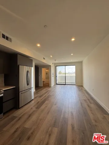 a view of a kitchen with a sink and dishwasher