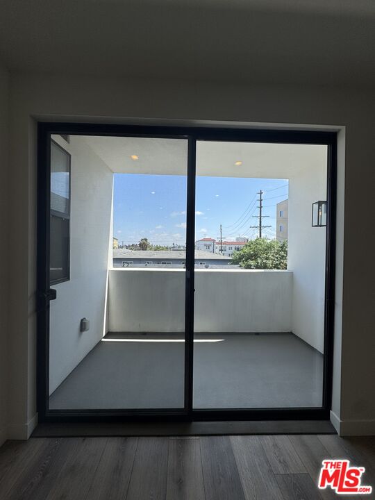 919 South Harvard Boulevard, Unit 403 Los Angeles, CA 90006 - Photo 4 of 9 a view of an empty room with a window