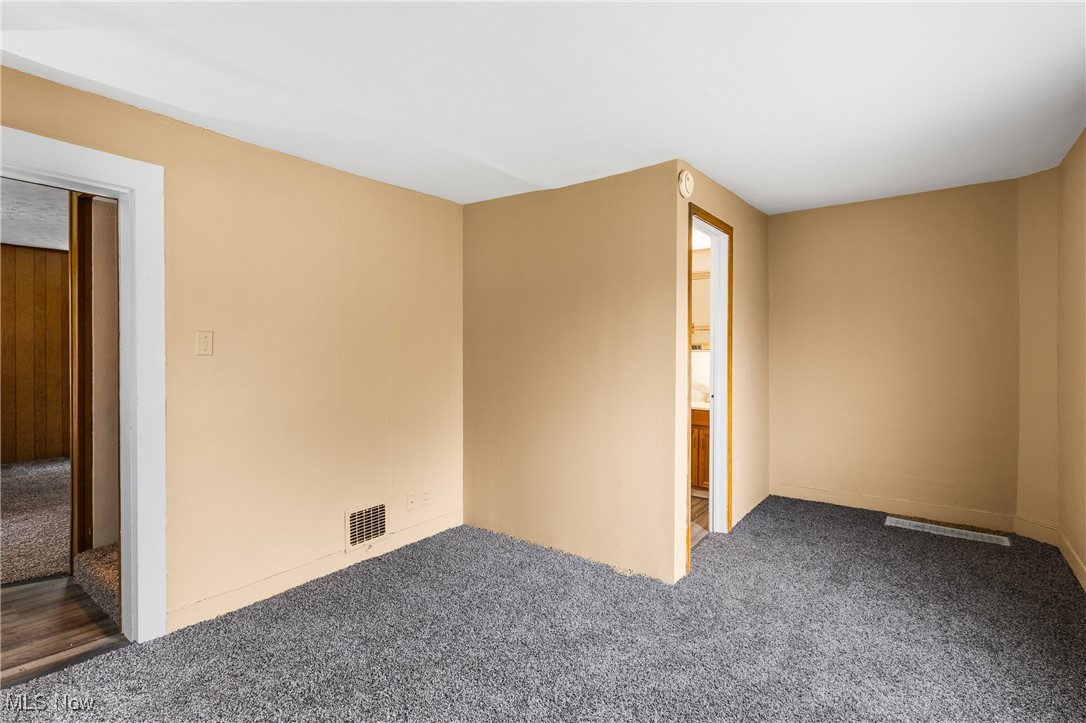 7529 State Line Burghill, OH 44404 - Photo 12 of 23 Carpeted empty room with baseboards