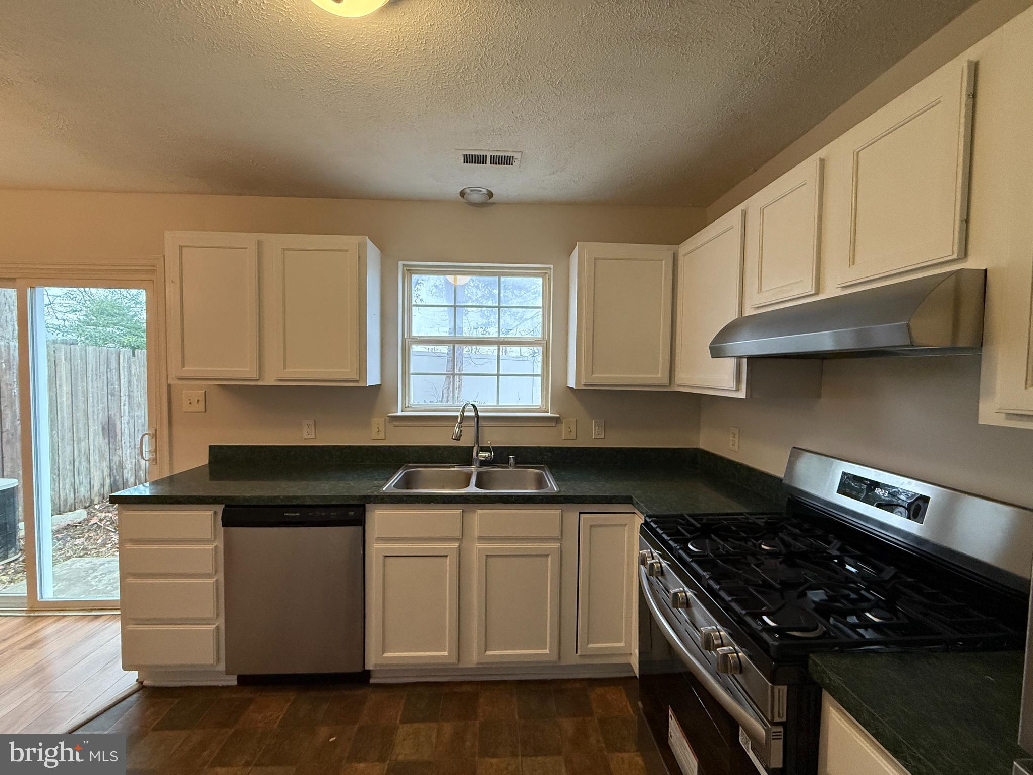 4345 Normandy Court Fredericksburg, VA 22408 - Photo 12 of 44 a kitchen with granite countertop a sink stove and cabinets