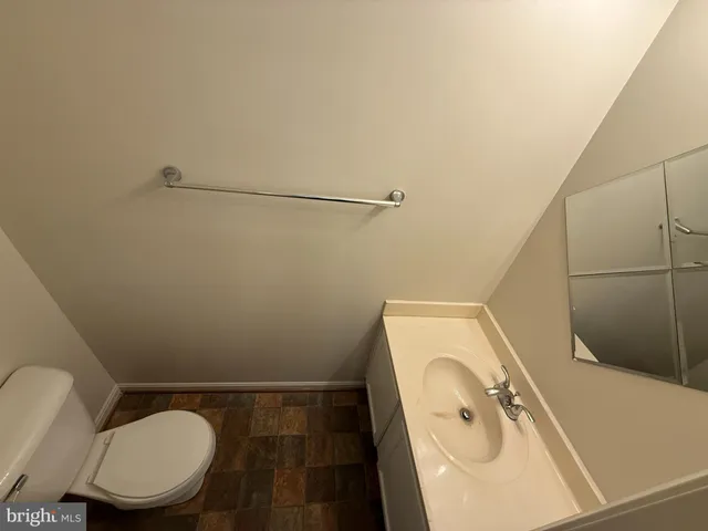 a bathroom with a toilet and a sink