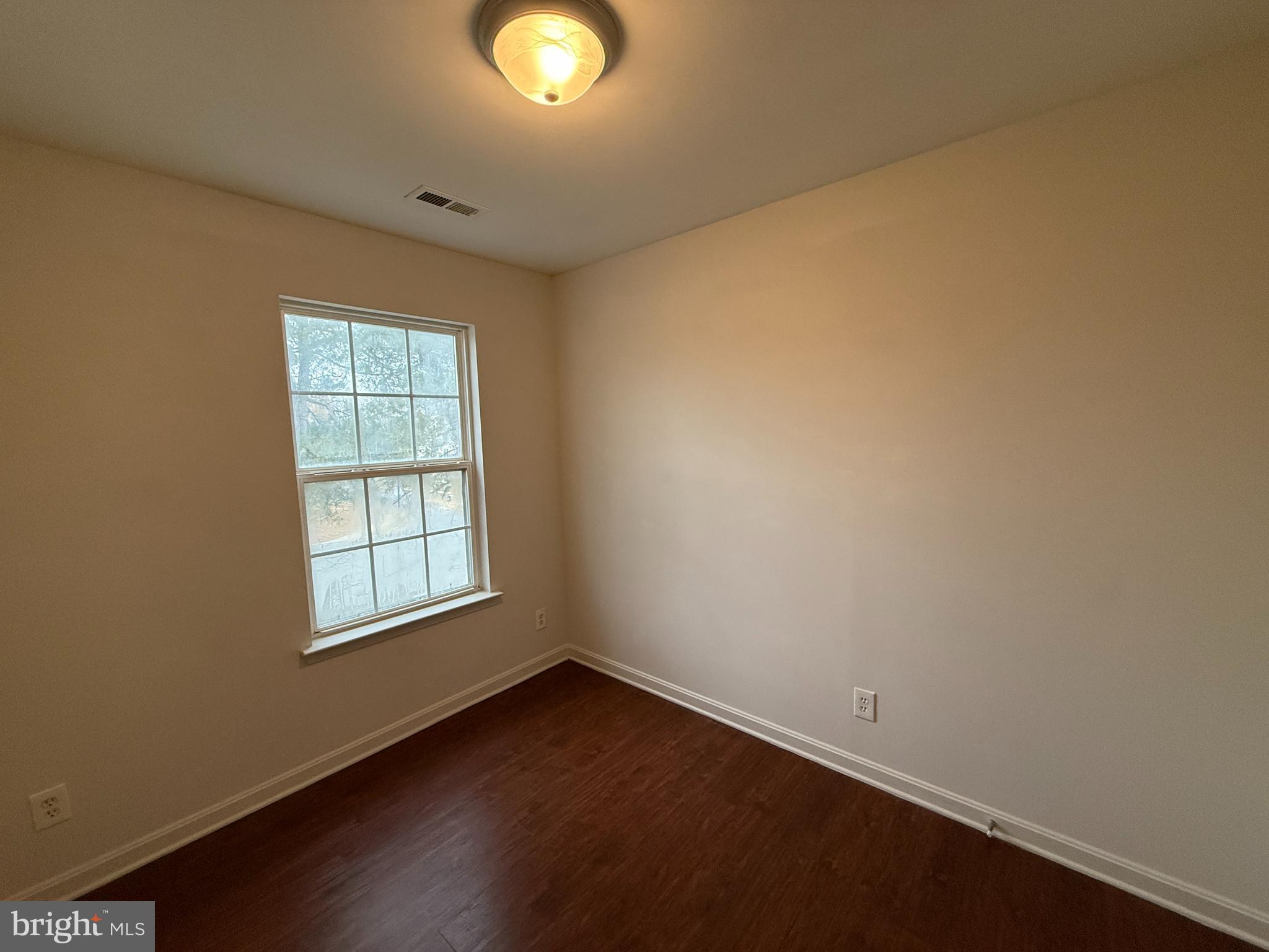 4345 Normandy Court Fredericksburg, VA 22408 - Photo 24 of 44 an empty room with wooden floor and windows