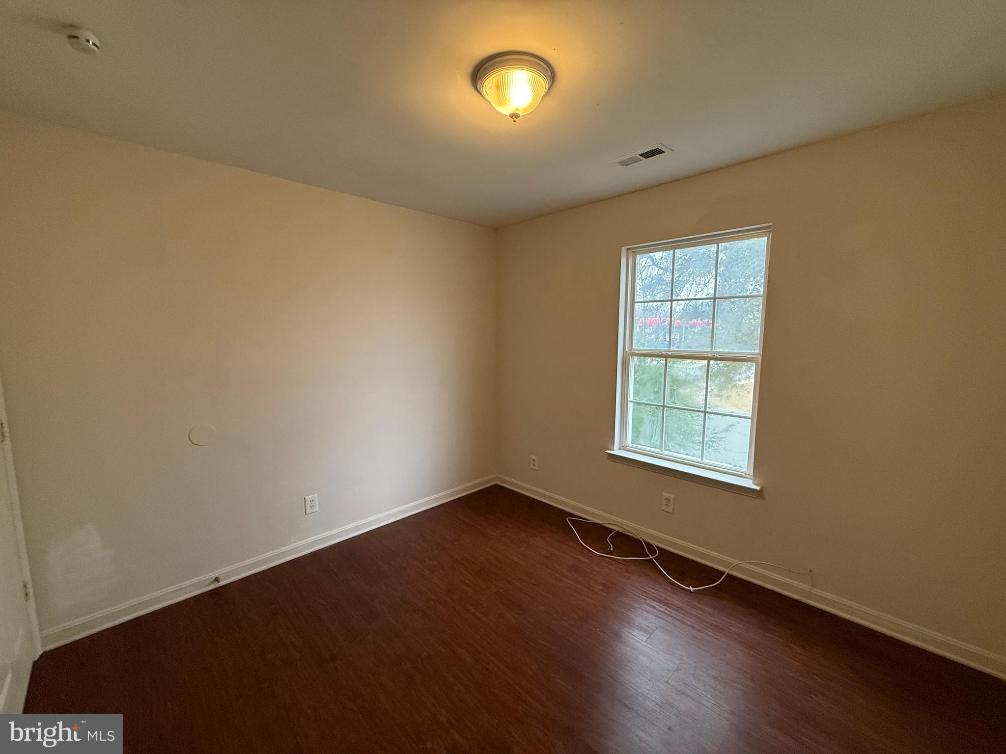 4345 Normandy Court Fredericksburg, VA 22408 - Photo 27 of 44 an empty room with wooden floor and windows