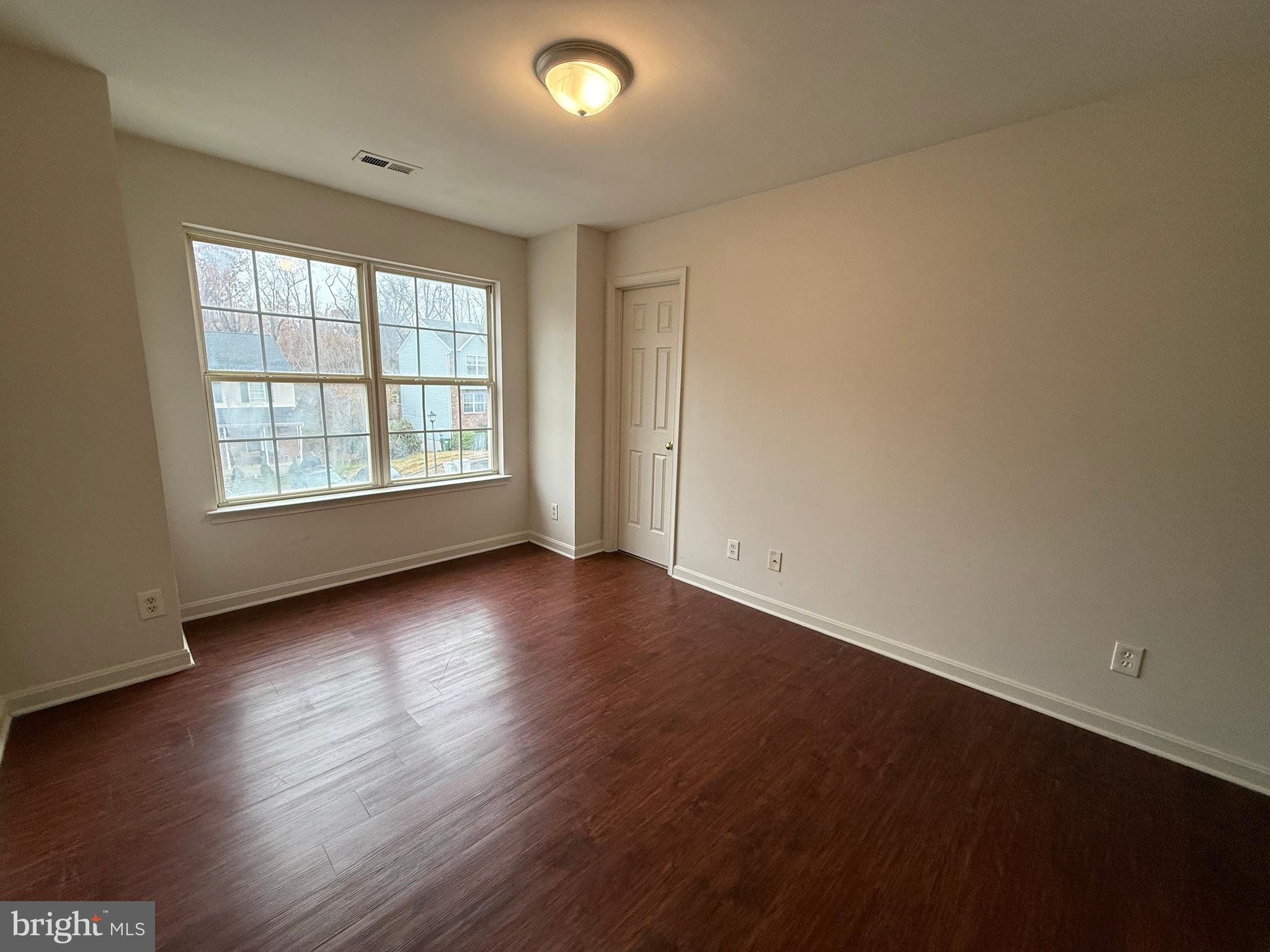 4345 Normandy Court Fredericksburg, VA 22408 - Photo 34 of 44 an empty room with wooden floor and windows