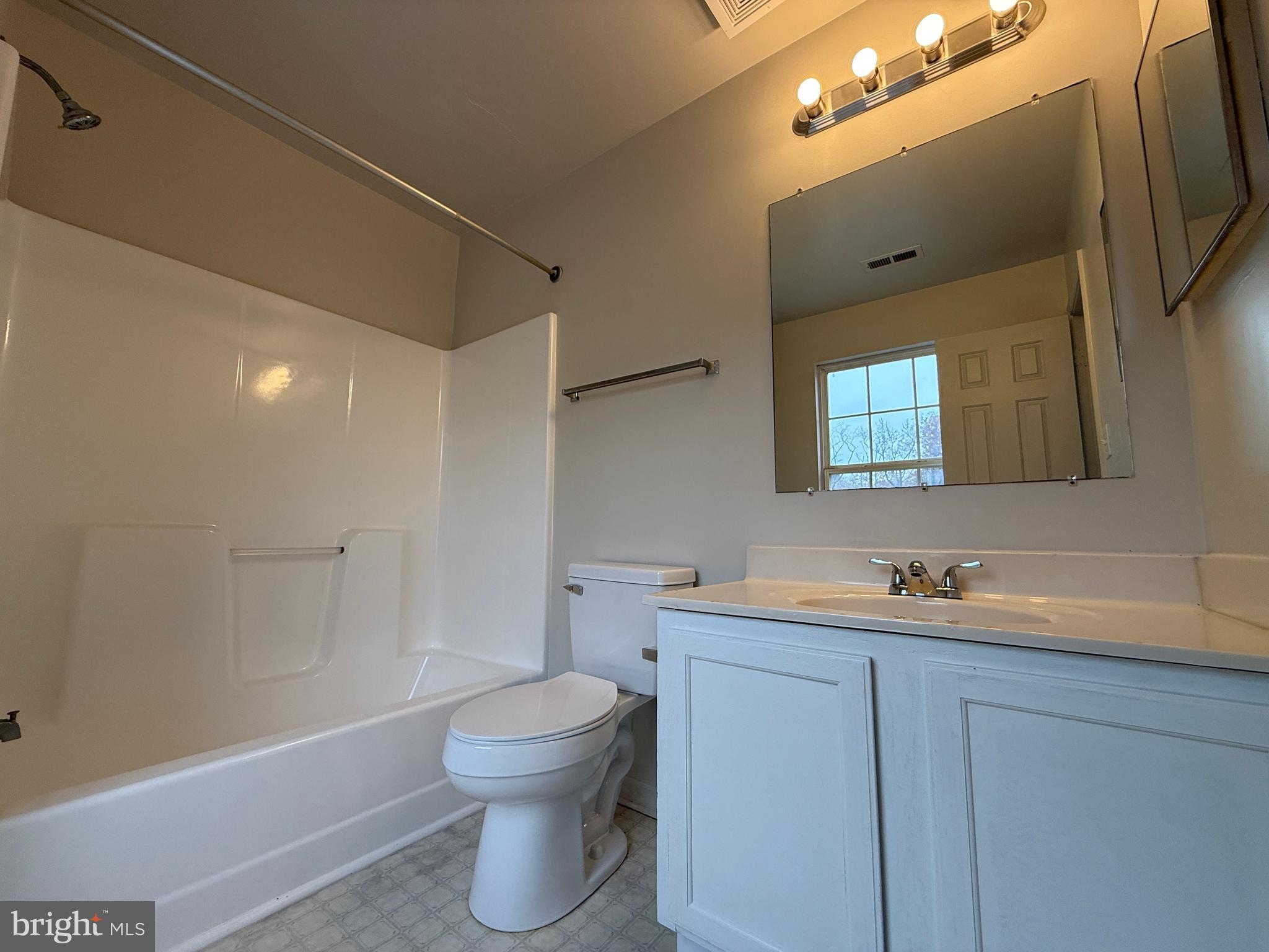 4345 Normandy Court Fredericksburg, VA 22408 - Photo 37 of 44 a bathroom with a toilet sink and mirror