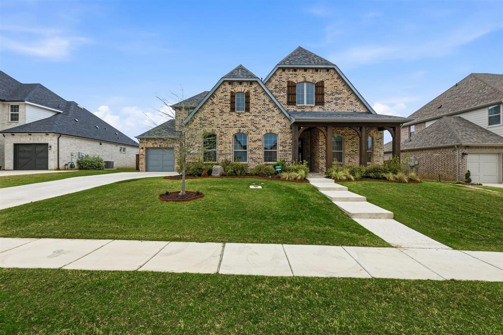 11116 Emory Oak Ridge Flower Mound, TX 76226 - Photo 1 of 40 a front view of a house with a yard