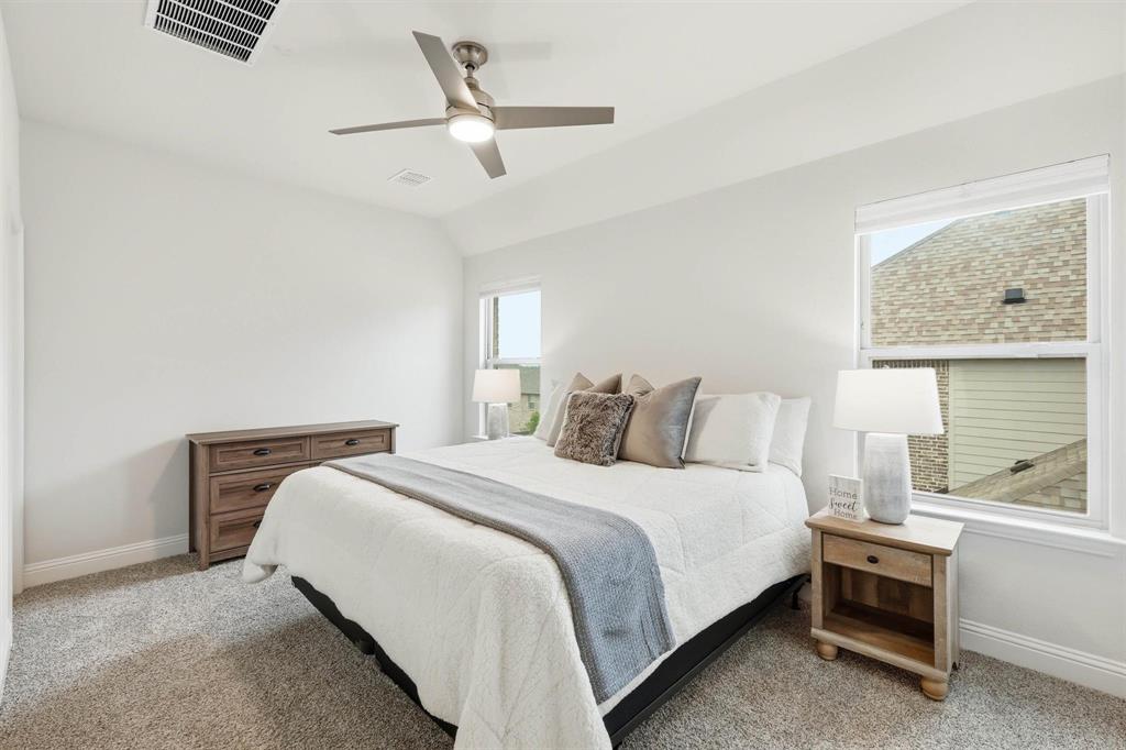 11116 Emory Oak Ridge Flower Mound, TX 76226 - Photo 27 of 40 a bedroom with a bed and a window