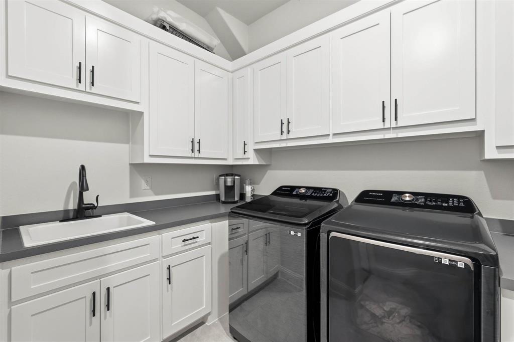 11116 Emory Oak Ridge Flower Mound, TX 76226 - Photo 29 of 40 a kitchen with granite countertop a sink stove and cabinets