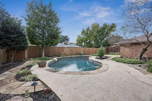a backyard with wooden fence