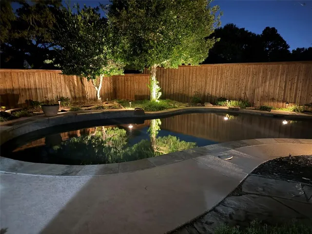 a view of swimming pool and patio