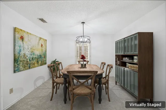 a dining room with furniture and window