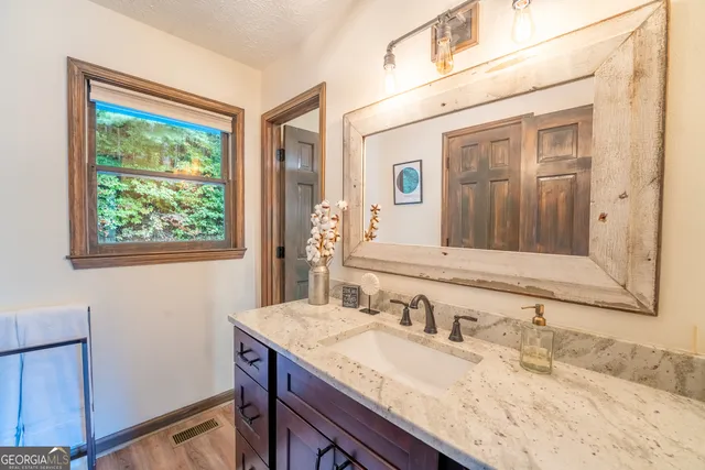 a terrace view with two chairs and a table