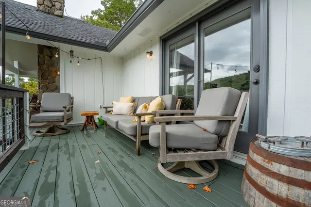 a bedroom with a bed window and a table in it